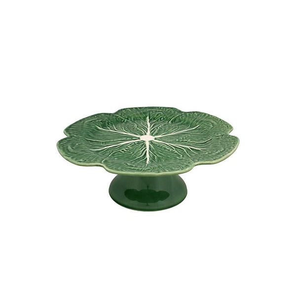 Bordallo Pinheiro Bordallo Pinheiro Cabbage Cake Stand | Luxury Handmade Ceramics: This Cabbage Cake Stand from the Bordallo Pinheiro Cabbage collection is a standout piece of cabbage ceramics, leaf-shaped dish, green ceramic serveware, handcrafted in Portugal, Bordallo Pinheiro. Handmade in Portugal, it blends artistic detail with functional charm—perfect as a collector’s item or for elevating your daily table setting.