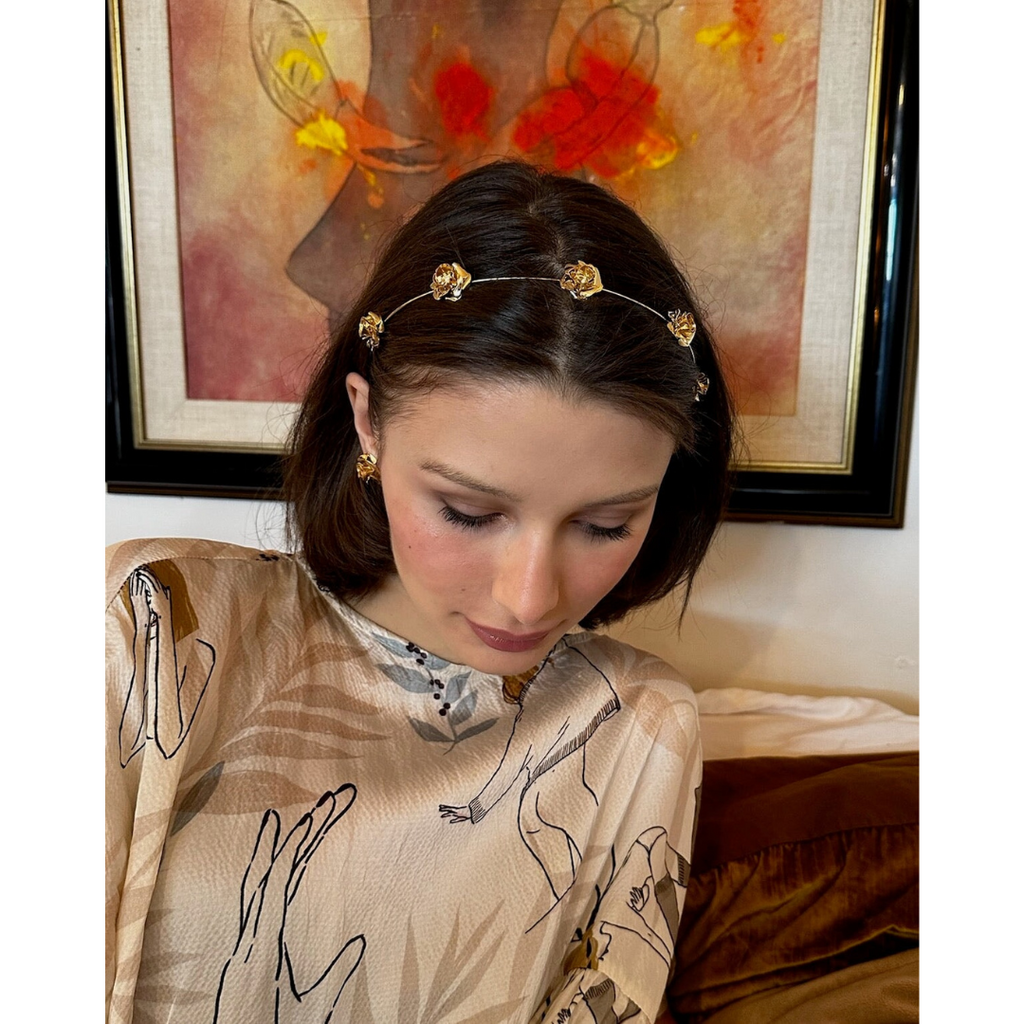woman wearing the Field of Roses Circlet – 14K gold plated budding rose luxury designer hair accessory