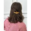 woman wearing Field of Roses French barrette – 14K gold plated luxury designer hair accessory